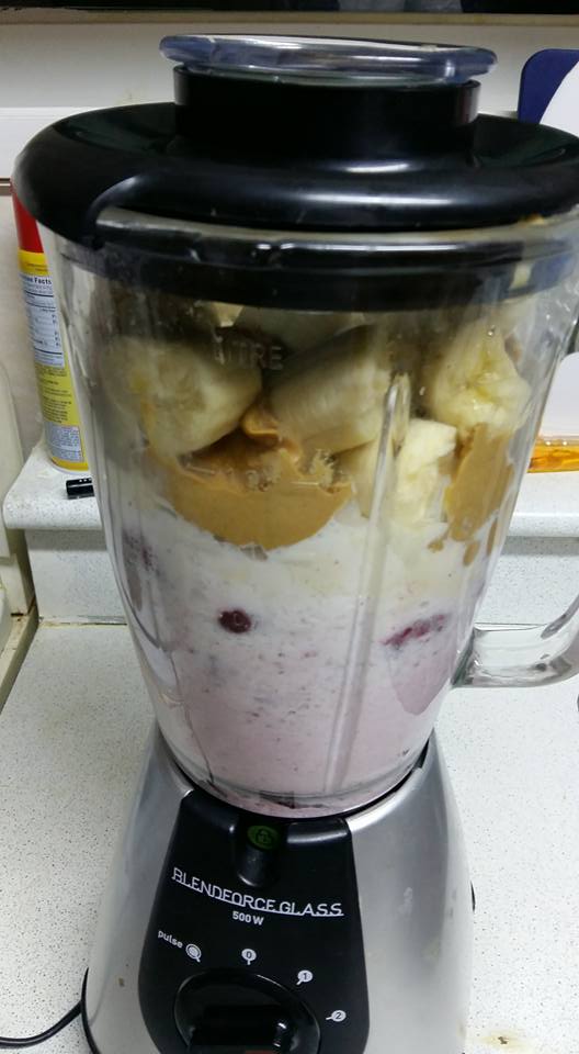 So I loaded up the blender with strawberries, bananas, peanut butter, a little ice cream, and milk...