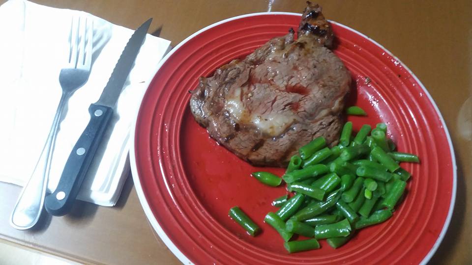 I celebrated my good(?) fortune with a rib-eye steak and green beans.